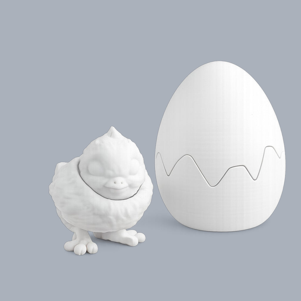Colorful Chick and Egg figurine from Driftwood 3D Printworks' Paint-A-Flexi collection, showcasing detailed painted designs.