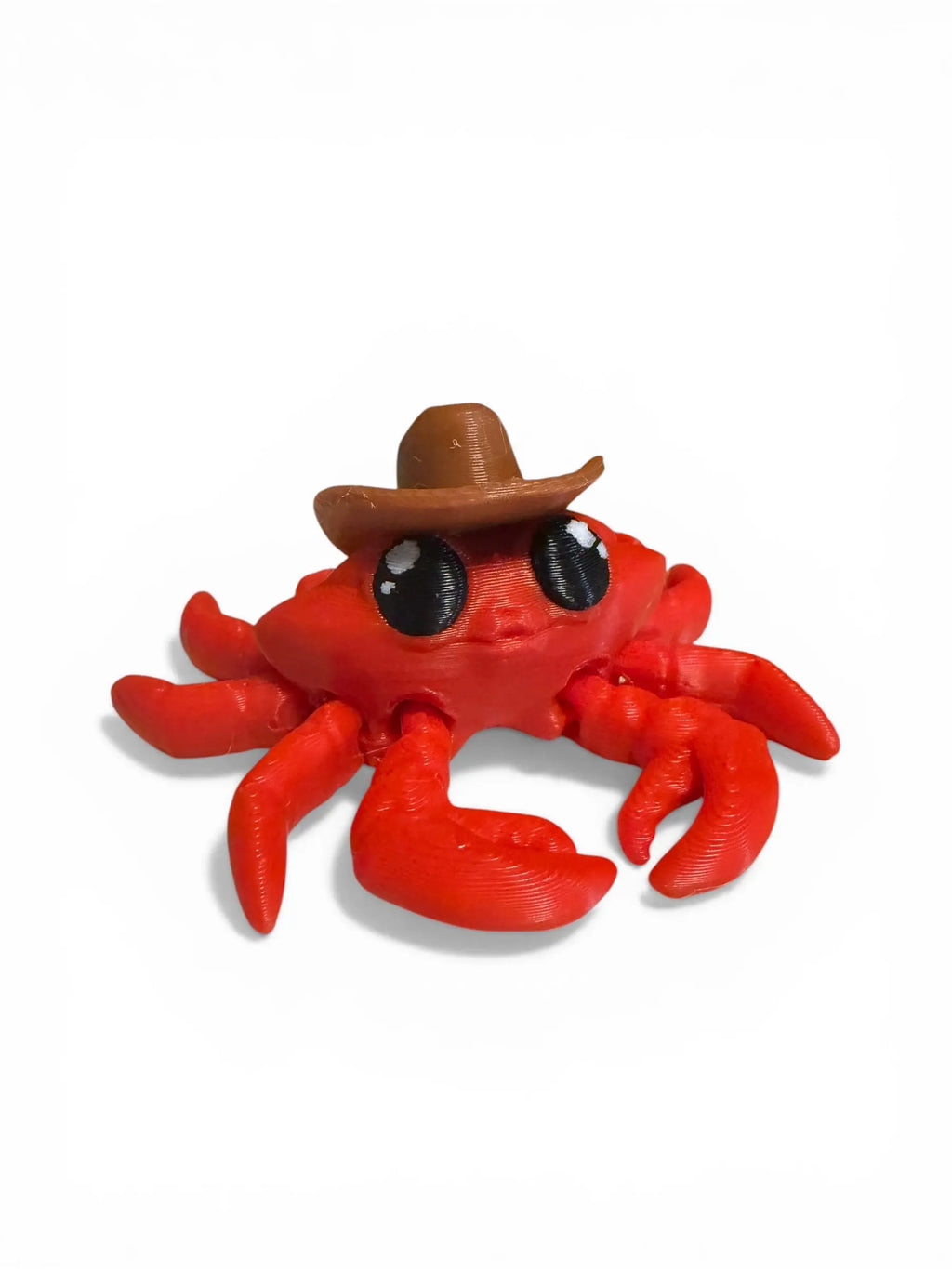 Red crab toy with a brown cowboy hat on a white background