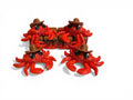 Red crab figurines with cowboy hats on a white background