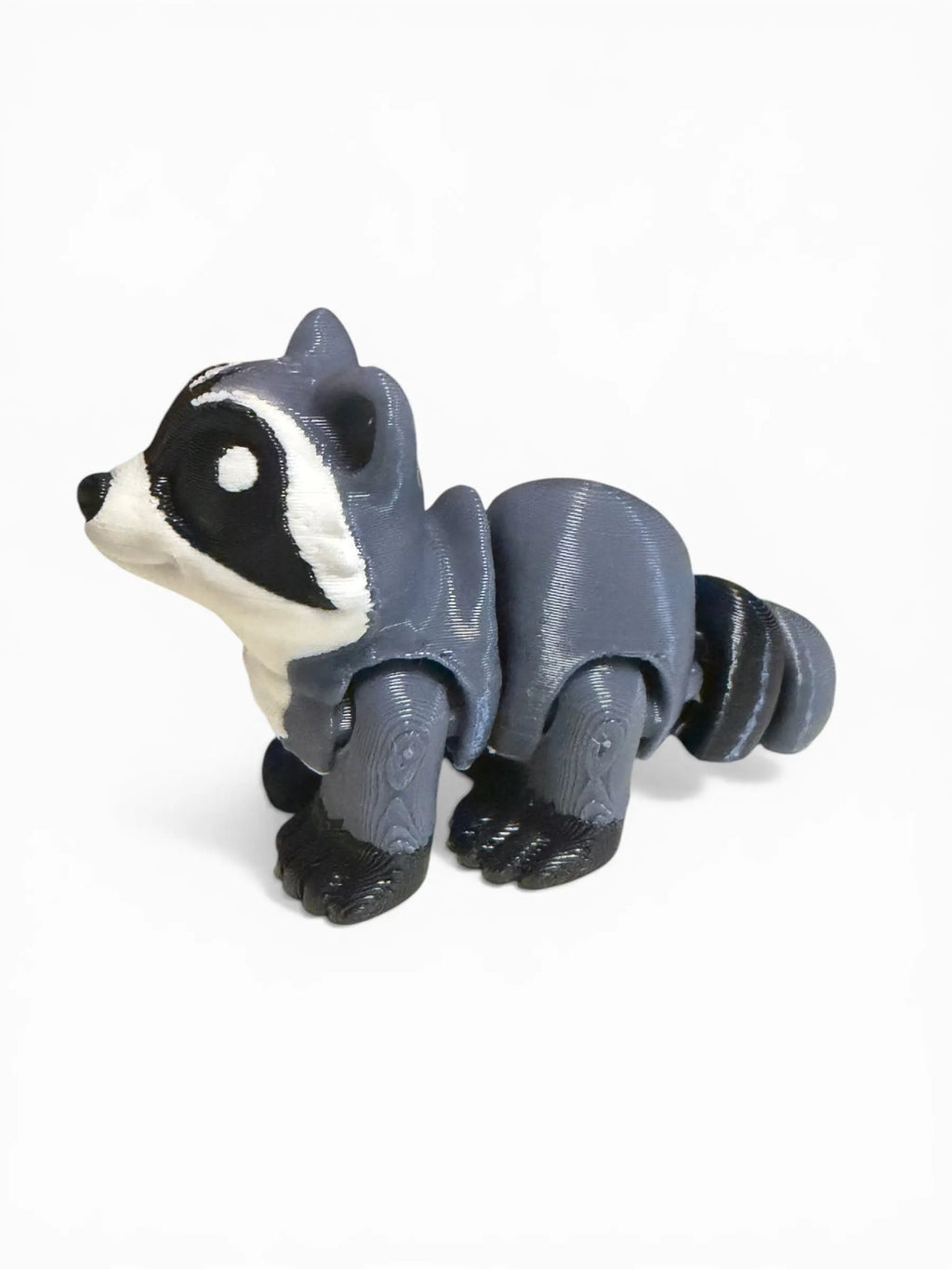 Toy raccoon figure on a white background