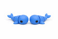 Two blue flexi whales on a white background