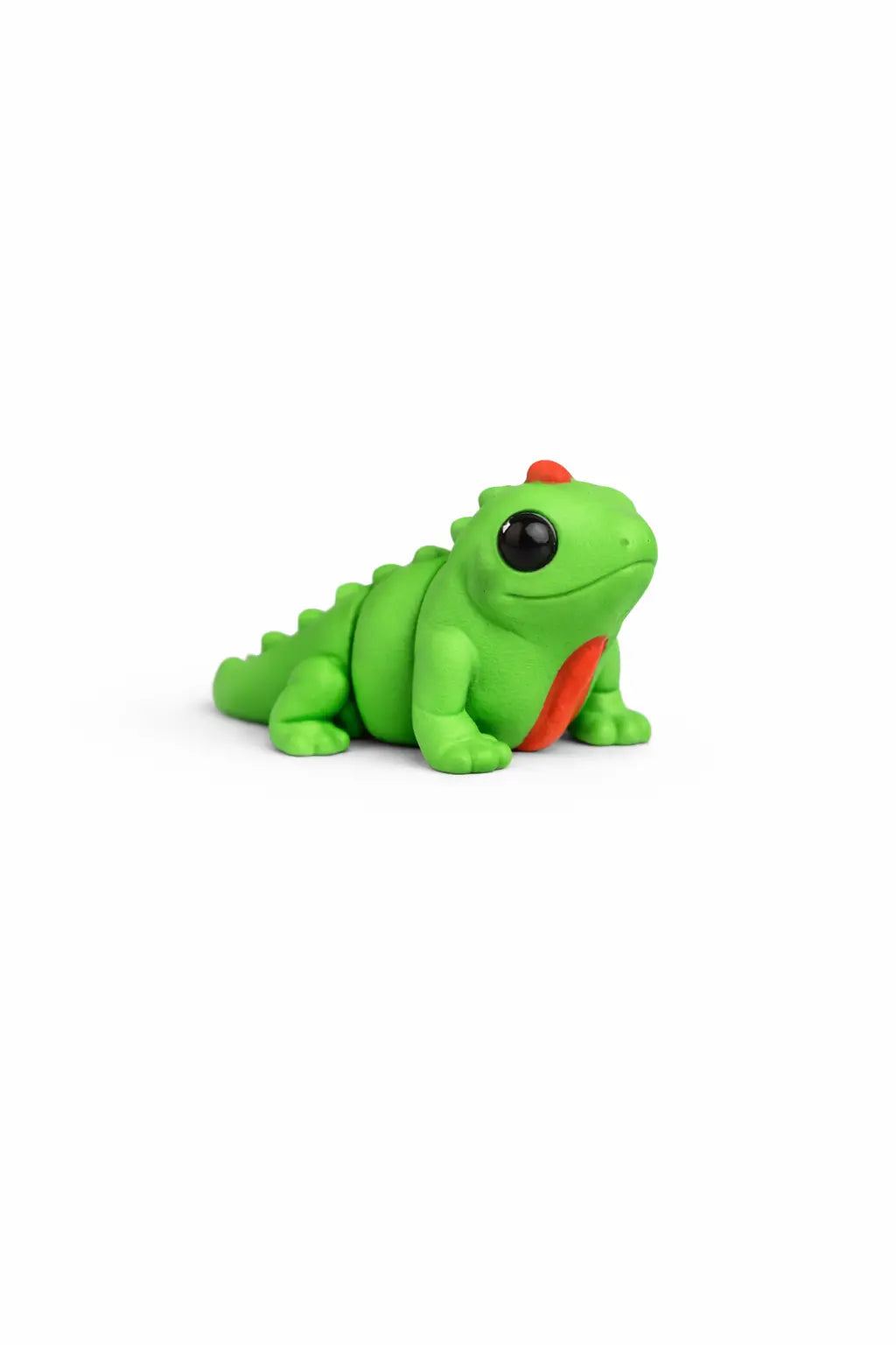 Green toy iguana on a white background