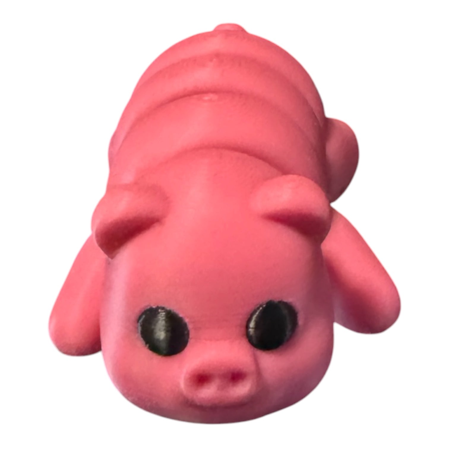 Flexible purple pig toy from Driftwood 3D Printworks, showcasing its soft, bendable design and detailed 3D print texture.