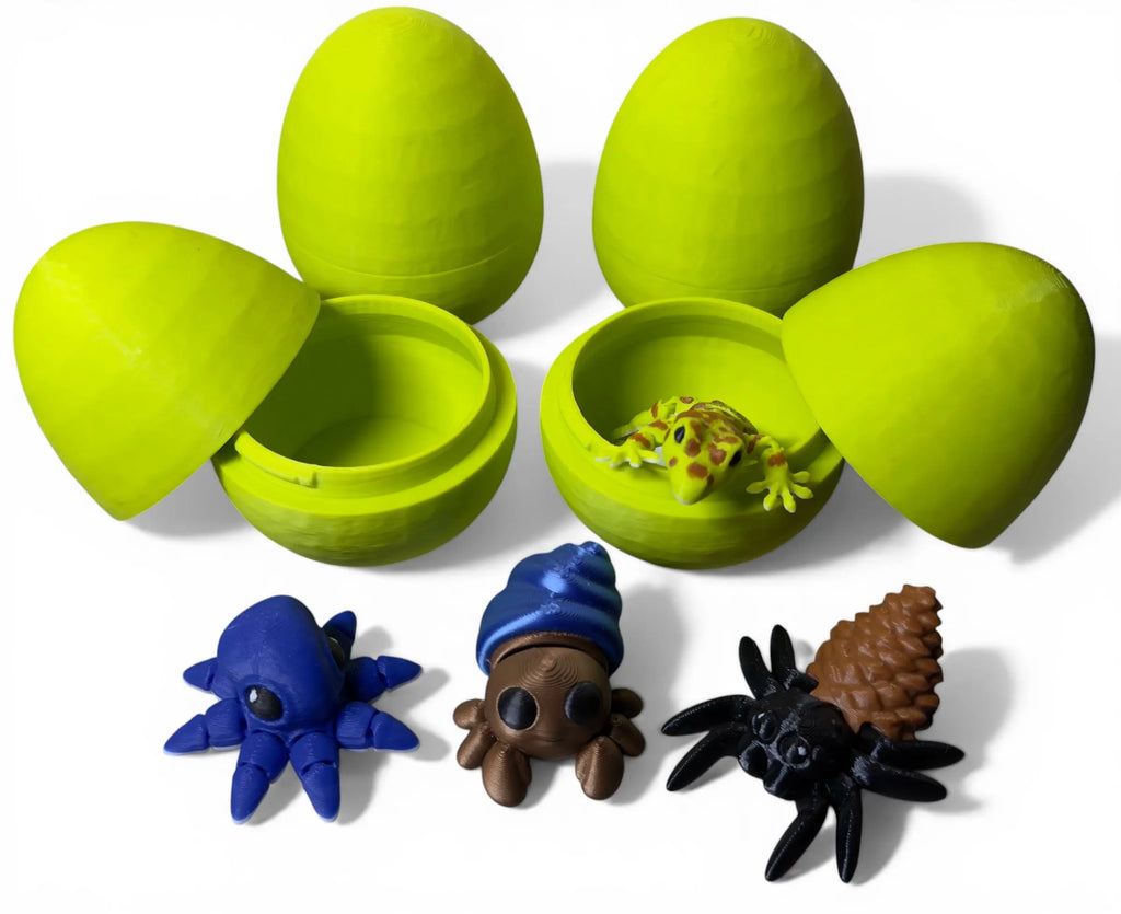 Set of green toy eggshells with small toy creatures on a white background