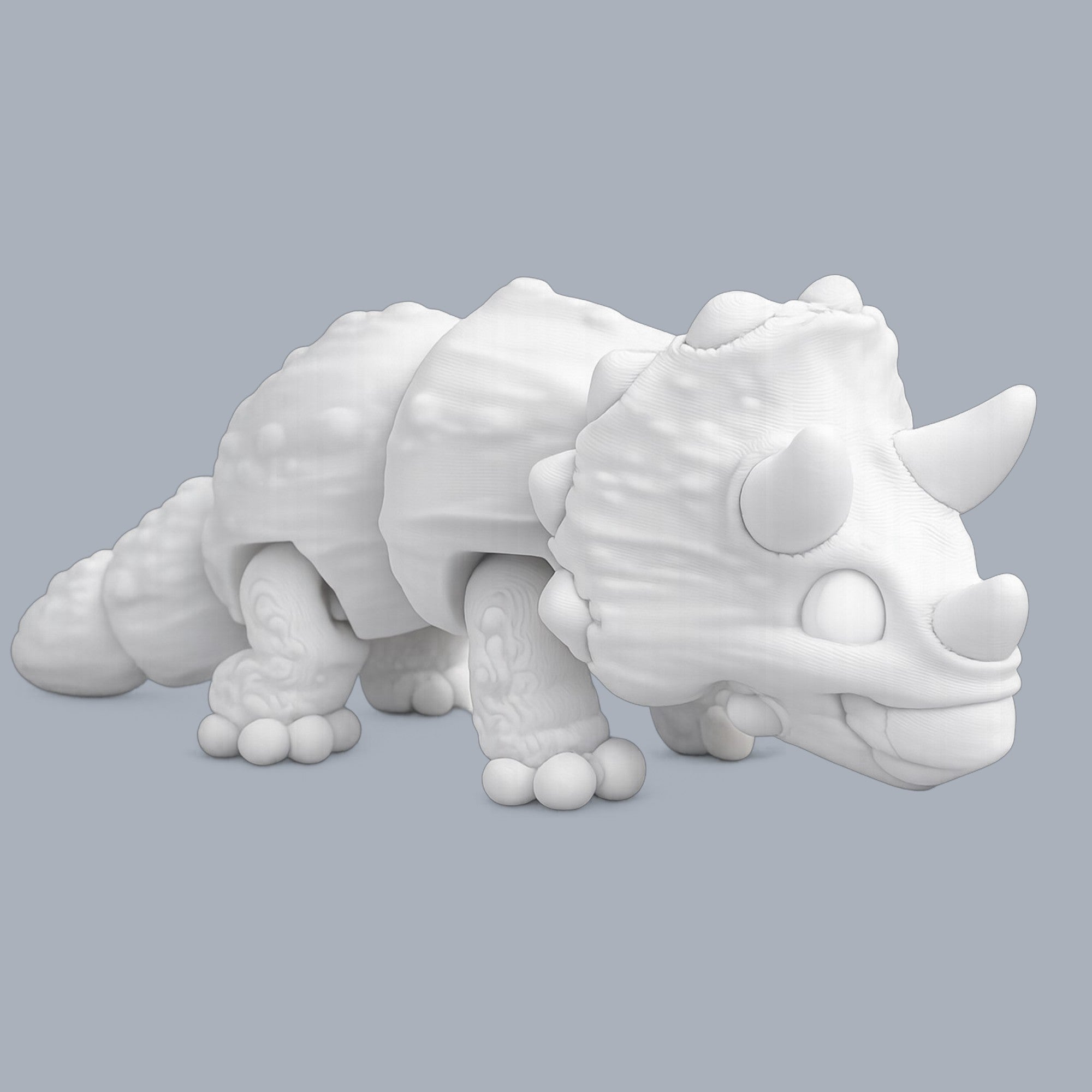 Paint-A-Flexi Triceratops model by Driftwood 3D Printworks, showcasing a colorful, flexible dinosaur figure for creative painting projects.